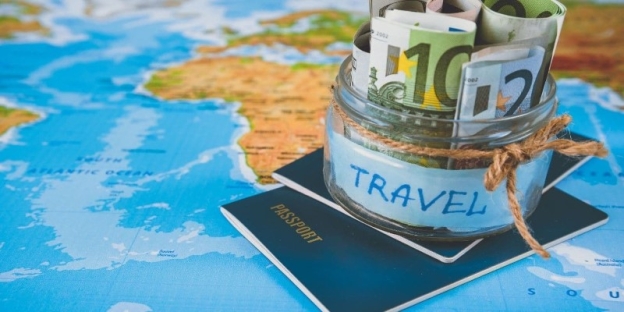 A passport and money in a jar AI-generated content may be incorrect.