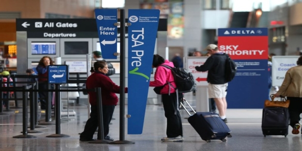 A group of people at an airport AI-generated content may be incorrect.