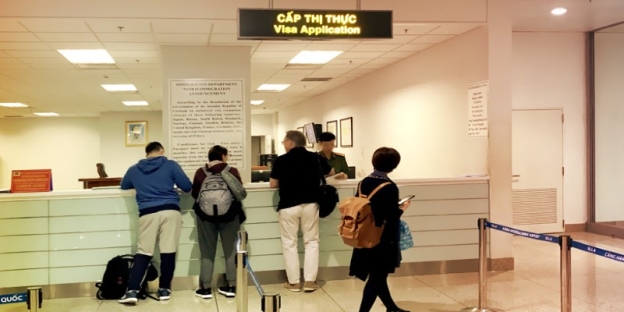People standing in front of a counter AI-generated content may be incorrect.